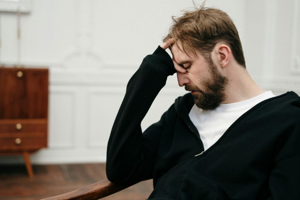 a man worried and thinking about why do addicts relapse